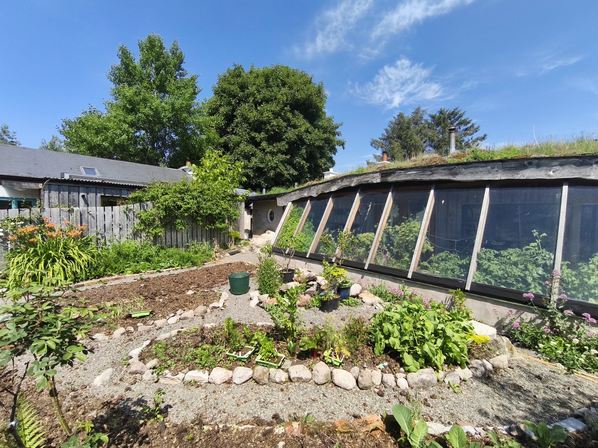 The zone0 permaculture garden outside our earthship conservatory